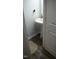 Half bathroom with a pedestal sink and stylish wood-look flooring at 113 Pelsett St, Durham, NC 27703