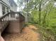 The home's backyard features a wood chip path near a slatted deck and lush foliage at 118 Trafalgar Ln, Cary, NC 27513