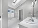 Bathroom with double vanity, jetted tub, and skylight at 118 Trafalgar Ln, Cary, NC 27513