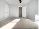 Bedroom with carpet, double door closet and window at 118 Trafalgar Ln, Cary, NC 27513