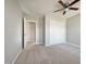 Bedroom with ceiling fan, carpet, and double door closet at 118 Trafalgar Ln, Cary, NC 27513