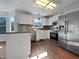 Updated kitchen featuring granite countertops and stainless steel appliances at 118 Trafalgar Ln, Cary, NC 27513