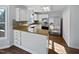 Galley kitchen with granite countertops and stainless steel appliances at 118 Trafalgar Ln, Cary, NC 27513