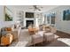 Virtually staged living room with fireplace and built in shelving at 118 Trafalgar Ln, Cary, NC 27513