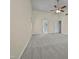 Large main bedroom with carpet and access to additional rooms at 118 Trafalgar Ln, Cary, NC 27513