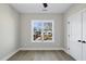 Bright bedroom featuring hardwood floors and a large window at 1208 Gearwood Ave, Durham, NC 27701