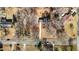Overhead view reveals the home's position on a tree-filled lot in a residential neighborhood at 1219 Carlton Ave, Burlington, NC 27217