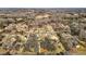 Neighborhood aerial view shows houses in a wooded landscape, highlighting the community setting at 1219 Carlton Ave, Burlington, NC 27217