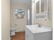 Bright bathroom featuring white vanity, a matching medicine cabinet, and tiled flooring at 1219 Carlton Ave, Burlington, NC 27217
