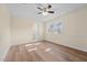 Bedroom featuring hardwood floors and natural light from the large window at 1219 Carlton Ave, Burlington, NC 27217
