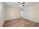 Bedroom with hardwood floors, a ceiling fan, closet, and window at 1219 Carlton Ave, Burlington, NC 27217