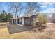 Cozy home showcases a neat yard with a screened-in porch to enjoy the outdoors at 1219 Carlton Ave, Burlington, NC 27217