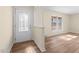 Bright foyer featuring a decorative glass front door and hardwood floors at 1219 Carlton Ave, Burlington, NC 27217