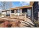 Traditional home featuring a brick front porch and landscaped yard at 1219 Carlton Ave, Burlington, NC 27217