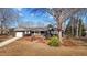 Charming single-story home features an inviting front porch and well-maintained landscaping at 1219 Carlton Ave, Burlington, NC 27217