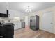 Well-lit kitchen featuring modern appliances and hardwood floors at 1219 Carlton Ave, Burlington, NC 27217