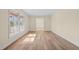 Sun-drenched living room with hardwood floors and neutral decor at 1219 Carlton Ave, Burlington, NC 27217