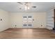 Spacious living room with wood flooring and glass doors to the backyard at 1219 Carlton Ave, Burlington, NC 27217