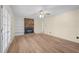 Open living room with wood flooring, brick fireplace, and built-in shelving at 1219 Carlton Ave, Burlington, NC 27217