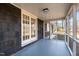 Relaxing screened porch featuring tongue and groove ceiling and blue painted floor at 1219 Carlton Ave, Burlington, NC 27217