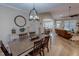 Bright dining room featuring a farmhouse table and chandelier at 131 Bessie Ln, Roxboro, NC 27574