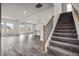 Modern staircase with iron railings leading to the upper level of the home at 14 E Victory View. Ter, Smithfield, NC 27577