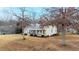 House exterior showcasing a charming front porch and large yard at 15 Madeira Dr, Franklinton, NC 27525