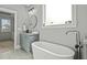 Spa-like bathroom with a soaking tub and modern vanity at 15 Willow Bend Dr, Youngsville, NC 27596