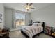 Cozy bedroom with a queen-size bed and large window at 15 Willow Bend Dr, Youngsville, NC 27596