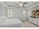 Spacious primary bedroom with large windows and plush carpeting at 15 Willow Bend Dr, Youngsville, NC 27596