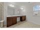 Bathroom featuring double sinks, granite countertops, and a tiled walk-in shower at 1700 Cary Reserve Dr, Cary, NC 27519
