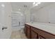 Bathroom features a shower-tub combo with sliding glass doors, and dark wood vanity at 1700 Cary Reserve Dr, Cary, NC 27519