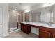 Bathroom featuring double sinks, granite countertops, and a tiled walk-in shower at 1700 Cary Reserve Dr, Cary, NC 27519