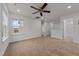 Large bonus room with neutral carpet and windows, versatile for any use at 1700 Cary Reserve Dr, Cary, NC 27519