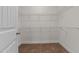 Walk-in closet with ample shelving and carpeted flooring, ready for organization at 1700 Cary Reserve Dr, Cary, NC 27519