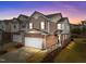 Charming townhome with brick facade, two-car garage, and well-manicured landscaping at 1700 Cary Reserve Dr, Cary, NC 27519