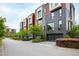 Modern townhouses with tree-lined street and city views at 202 Dundas Ln, Raleigh, NC 27603