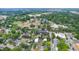 Aerial view of townhomes nestled in a vibrant, tree-lined neighborhood at 202 Dundas Ln, Raleigh, NC 27603