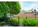Private backyard with black fence and green lawn at 202 Dundas Ln, Raleigh, NC 27603