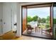 Private balcony with wooden deck, wicker chairs, and city view at 202 Dundas Ln, Raleigh, NC 27603