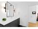 Modern bathroom with floating vanity and large mirror at 202 Dundas Ln, Raleigh, NC 27603