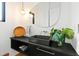 Modern bathroom with black sink and unique mirror at 202 Dundas Ln, Raleigh, NC 27603