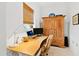 Dedicated home office with wood desk, comfortable chair, and built-in wooden cabinet at 202 Dundas Ln, Raleigh, NC 27603