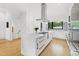 Open concept kitchen with large island and hardwood floors at 202 Dundas Ln, Raleigh, NC 27603