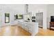 Modern kitchen with white cabinets, marble island, and stainless steel appliances at 202 Dundas Ln, Raleigh, NC 27603