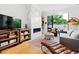 Spacious living room features a marble fireplace, built-in shelving, and large windows at 202 Dundas Ln, Raleigh, NC 27603