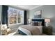 Bright bedroom with a queen-size bed and large window at 2326 Sugar Cone Way, Fuquay Varina, NC 27526