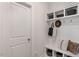 White mudroom with bench seating, cubbies, and hooks for bags at 2326 Sugar Cone Way, Fuquay Varina, NC 27526