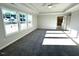 Spacious bedroom featuring large windows and neutral tones, creating a relaxing atmosphere at 25 Accord Dr, Youngsville, NC 27596