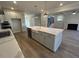 Open kitchen island with modern sink and stainless dishwasher at 25 Accord Dr, Youngsville, NC 27596